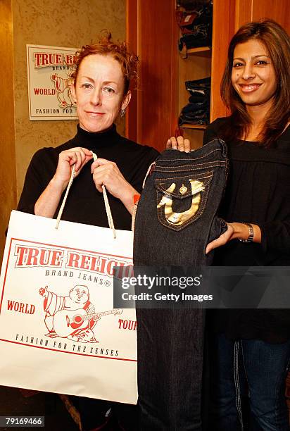 Director Catherine Owens poses with the True Religion display at the Gibson Guitar celebrity hospitality lounge held at the Miners Club during the...