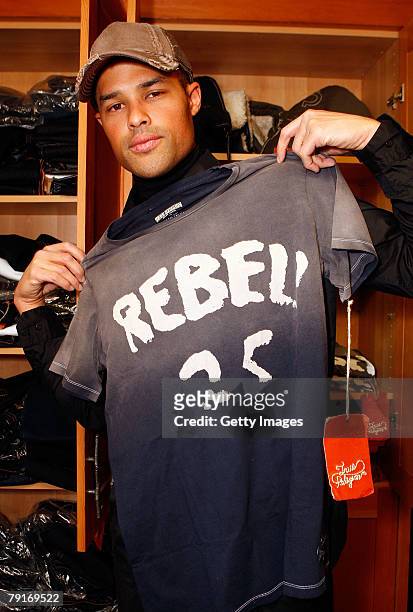 Actor Jason Olive poses with the True Religion display at the Gibson Guitar celebrity hospitality lounge held at the Miners Club during the 2008...