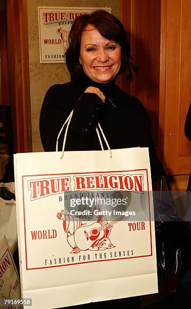 Actress Adriana Barraza poses with the True Religion display at the Gibson Guitar celebrity hospitality lounge held at the Miners Club during the...