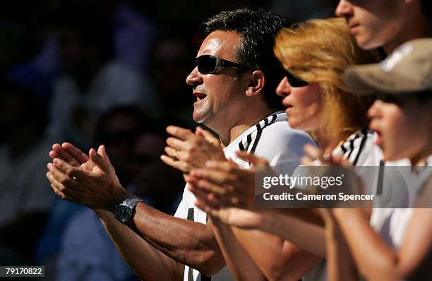 Srdjan and Dijana Djokovic, the father and mother of Novak Djokovic of Serbia applaud their son after winning his quarter-final match against David...