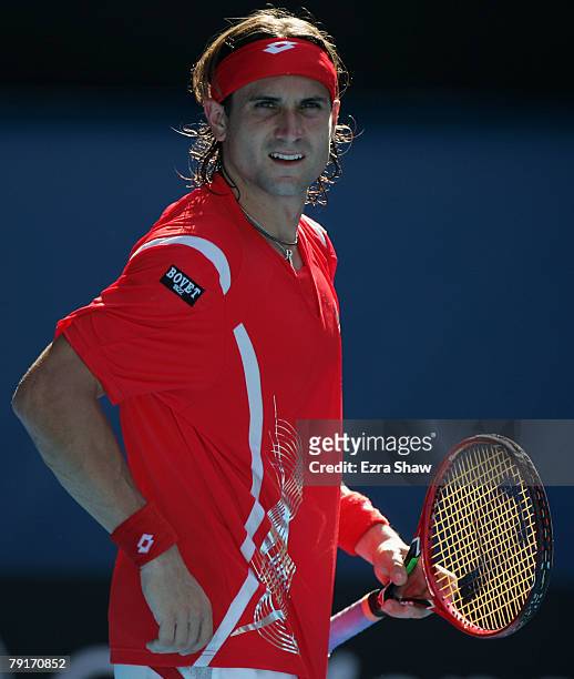 David Ferrer of Spain shows his frustration after a point during his quarter-final match against Novak Djokovic of Serbia on day ten of the...