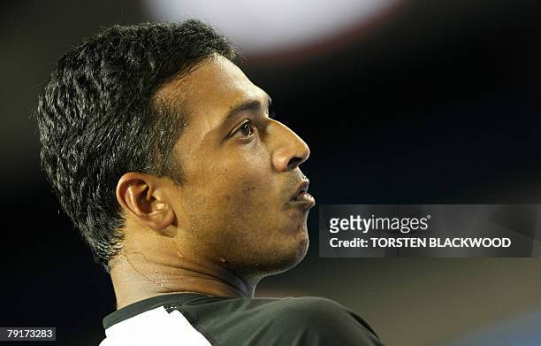 Indian tennis player Mahesh Bhupathi looks towards Bahamian partner Mark Knowles during their mens doubles match against US pair Bob and Mike Bryan...