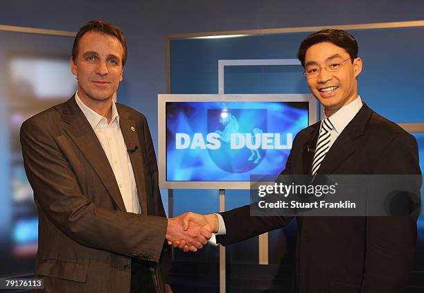 Philipp Roesler , candidate of the Free Democrats and Stefan Wenzel , candidate of the Greens Party attend a television debate the NDR television...