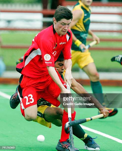 Martin Zwicker is tackled Shanyl Balwanth during the Five Nations Mens Hockey tournament match between South Africa and Germany held at the North...
