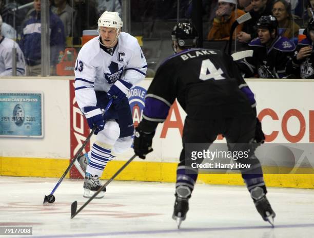 Mats Sundin of the Toronto Maple Leafs skates with the puck against Rob Blake of the Los Angeles Kings during the game at the Staples Center on...