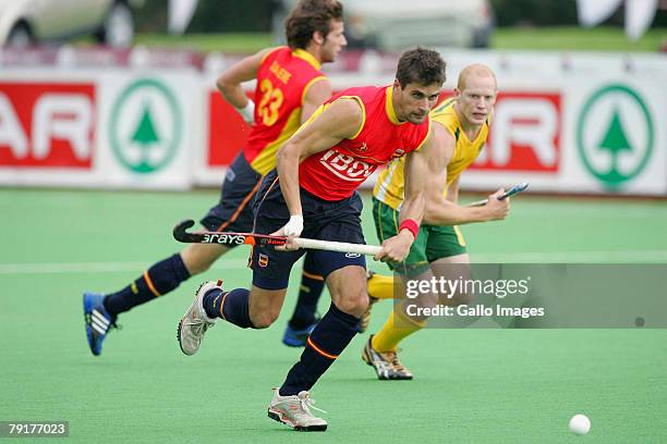 Pol Amat chased by Robert Hammond during the Five Nations Men's Hockey tournament match between Australia and Spain held at the North West University...