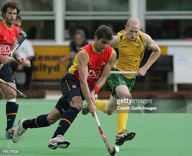 Pol Amat chased by Robert Hammond during the Five Nations Men's Hockey tournament match between Australia and Spain held at the North West University...