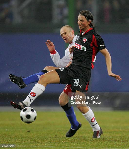 David Jarolim of Hamburg and Dennis Flinta of Midtjyland compete for the ball during the friendly match between Hamburger SV and FC Midtjyland at the...