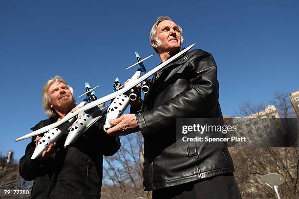 Sir Richard Branson of Virgin Atlantic and designer Burt Rutan hold up a model of a spaceship unveiled at a news conference January 23, 2008 in New...