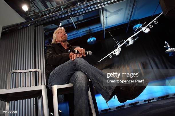 Sir Richard Branson of Virgin Atlantic sits beside a model of a spaceship unveiled at a news conference January 23, 2008 in New York City. Branson...