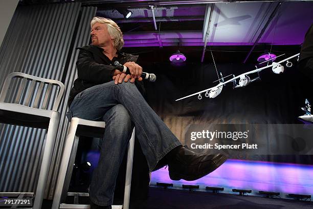 Sir Richard Branson of Virgin Atlantic sits beside a model of a spaceship unveiled at a news conference January 23, 2008 in New York City. Branson...