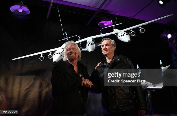 Sir Richard Branson of Virgin Atlantic and designer Burt Rutan stand under a model of a spaceship unveiled at a news conference January 23, 2008 in...