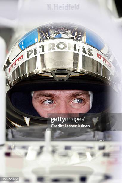 Nick Heidfeld of Germany and team BMW Sauber waits in his car inside the team's garage during Formula one testing at the Ricardo Tormo racetrack on...
