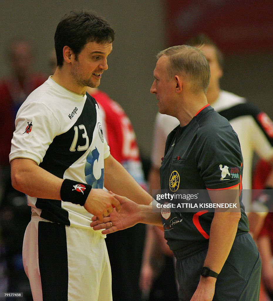 Germany's middle back Markus Baur (L) ar