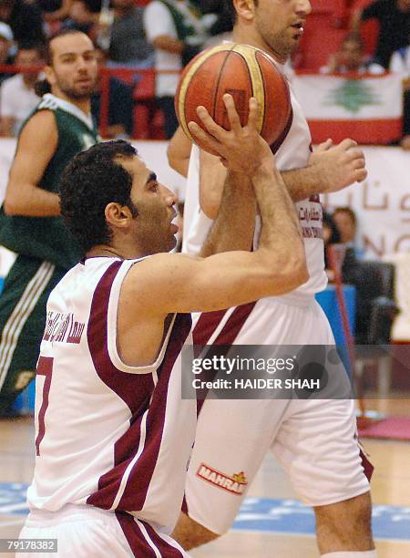 Mahdi Kamrani of Iranian Mohram club, shoots the ball during a basketball match against Lebanon's Sagesse club at the 19th Dubai International...