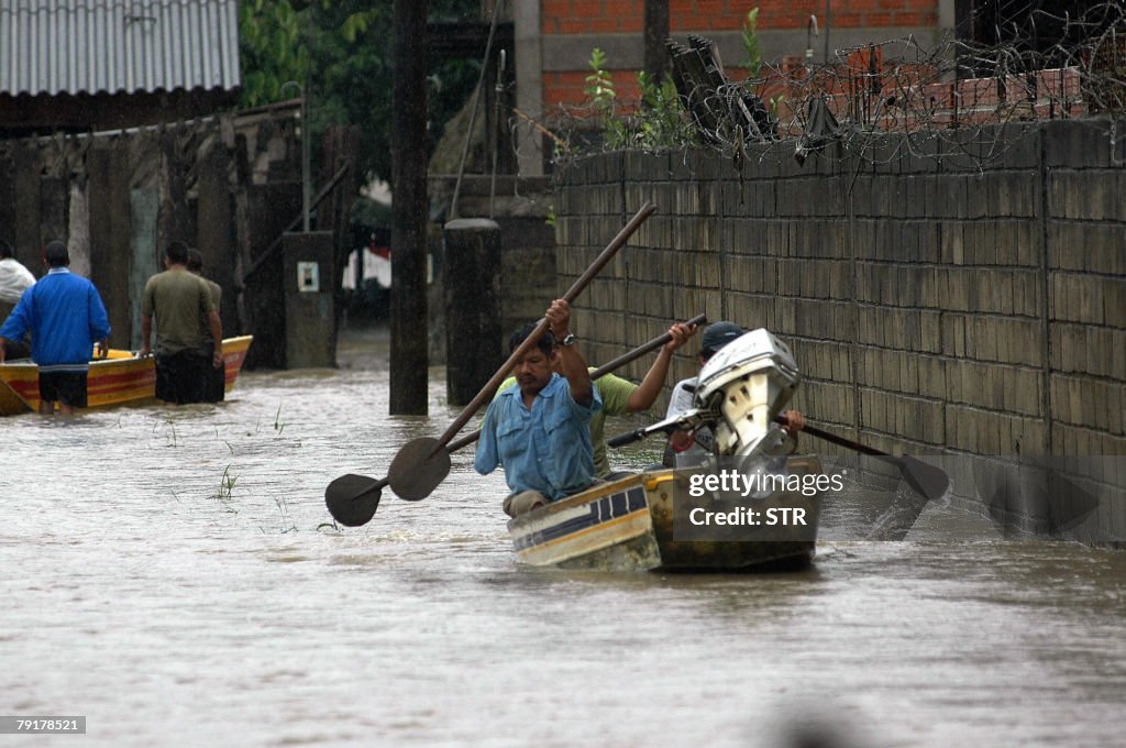 Local residents sail on boat in the floo