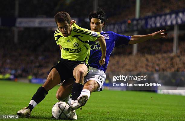 Joe Cole of Chelsea battles with Nuno Valente of Everton during the Carling Cup Semi Final Second Leg match between Everton and Chelsea at Goodison...