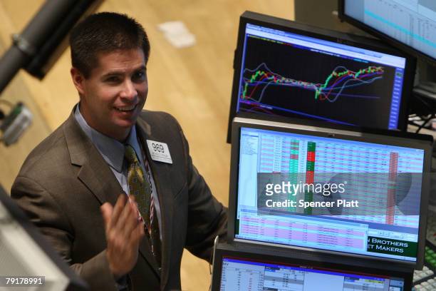 Trader works on the floor of the New York Stock Exchange January 23, 2008 in New York City. The Dow briefly hit positive territory Wednesday, after...