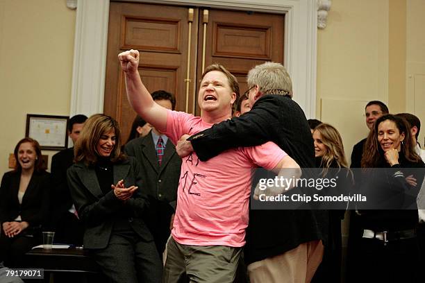 Writers Guild of America member and Daily Show writer Kevin Bleyer is dragged out of a hearing room by WGA President Michael Winship after imitating...