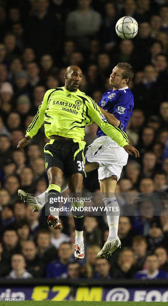 Phil Jagielka (R) of Everton vies with N