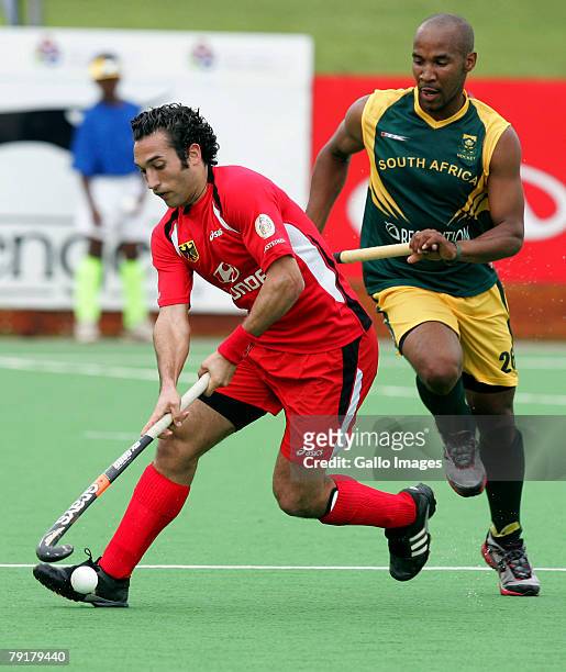 Carlos Nevado of South Africa and Julian Hykes of Germany during the Five Nations Mens Hockey tournament match between South Africa and Germany held...