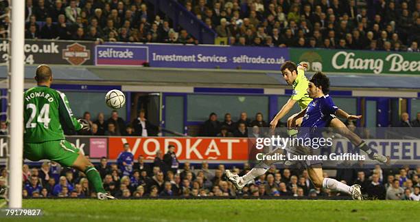 Joe Cole of Chelsea scores past Tim Howard of Everton during the Carling Cup Semi Final Second Leg match between Everton and Chelsea at Goodison Park...