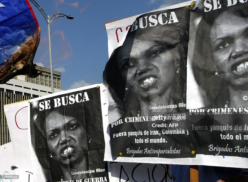 Colombians hold signs as they demonstrat