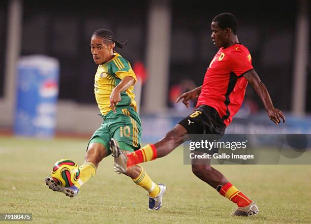 Steven Pienaar of South Africa and Joao Yamba of Angola during the Group D AFCON match between South Africa and Angola held at the Tamale Stadium on...