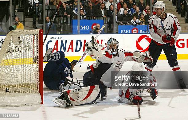 Olie Kolzig of the Washington Capitals is beat by Alex Steen of the Toronto Maple Leafs as Mike Green and Milan Jurcina both of the Washington...