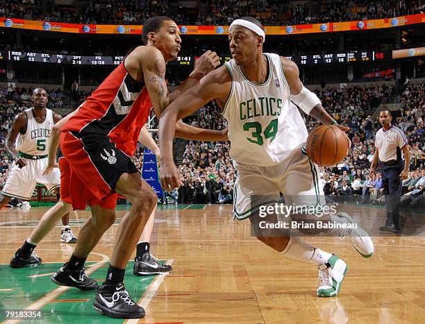 Paul Pierce of the Boston Celtics drives against Jamario Moon of the Toronto Raptors on January 23, 2008 at the TD Banknorth Garden in Boston,...