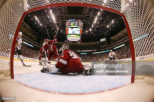 Ilya Bryzgalov of the Phoenix Coyotes protects the goal during the NHL game against the Chicago Blackhawks at the Jobing.com Arena on January 19,...