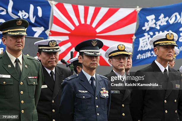 Members of Japan Maritime Self Defense Force attends a send-off ceremony for convoy "Murasame" departing for the Indian Ocean from their Yokosuka...