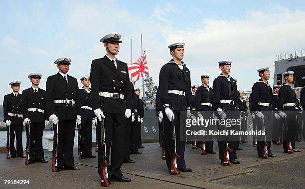 Members of Japan Maritime Self Defense Force attends a send-off ceremony for convoy "Murasame" departing for the Indian Ocean from their Yokosuka...