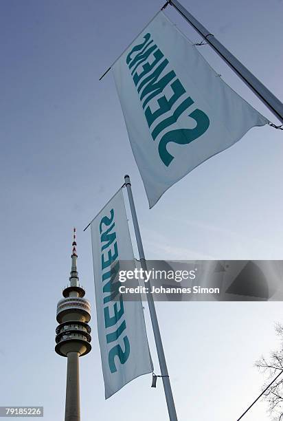 Flags of Siemens global powerhouse in electronics and electrical engineering are seen prior to the annual shareholder meeting at Olympiahalle on...