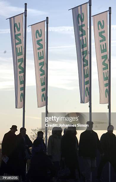 Shareholders of Siemens global powerhouse in electronics and electrical engineering arrive for the annual shareholder meeting at Olympiahalle on...