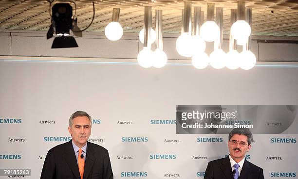 Peter Loescher , President and CEO of Siemens global powerhouse in electronics and electrical engineering, and CFO Joe Kaeser addresses the media...