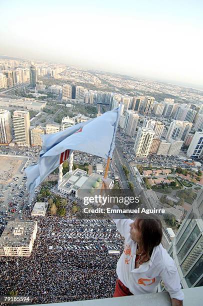 Alain Robert, nicknamed the 'French Spiderman', climbs the Abu Dhabi Investment Authority Tower, watched by a crowd of 100 000 onlookers, on February...