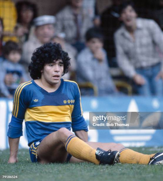 Boca Junior's striker Diego Maradona sits on the ground, Argentina League, circa 1981.