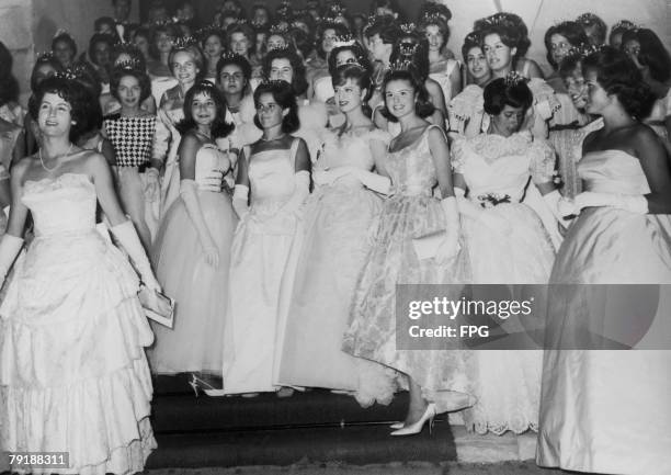 Large group of debutantes in tiaras, circa 1955.