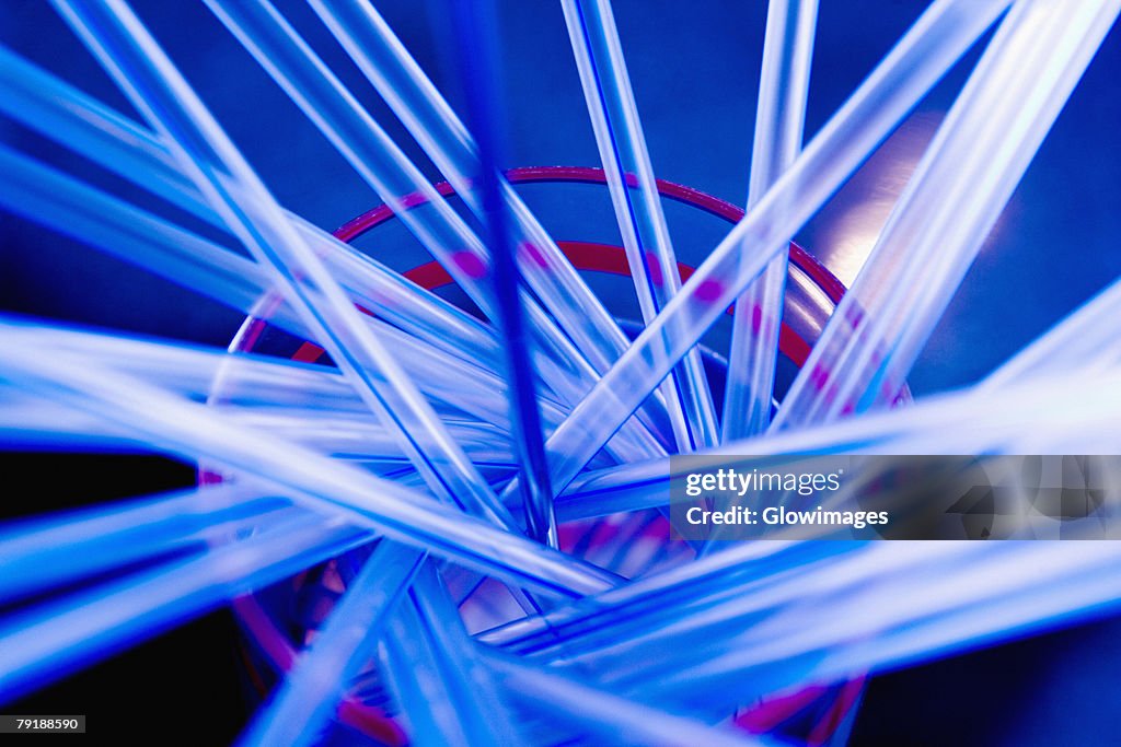 Close-up of drinking straws in a sink