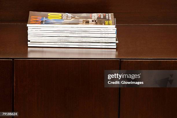 close-up of magazines on a table - magazine table stock pictures, royalty-free photos & images