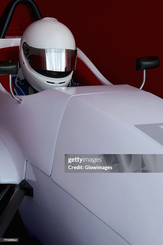 Close-up of a racecar driver in a racecar