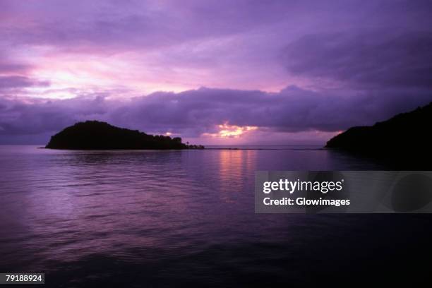 sunset over the sea, makogai island, fiji - makogai island stock pictures, royalty-free photos & images