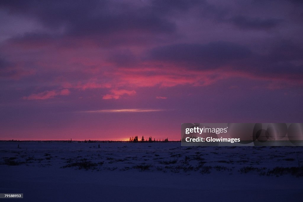 Sunset over a frozen landscape, Churchill, Manitoba, Canada