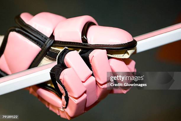 close-up of an ice hockey player's hand holding an ice hockey stick - hockey stick fotografías e imágenes de stock