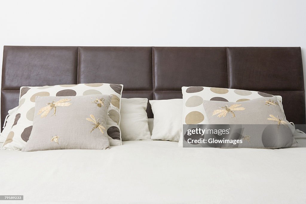 Cushions and pillows on the bed