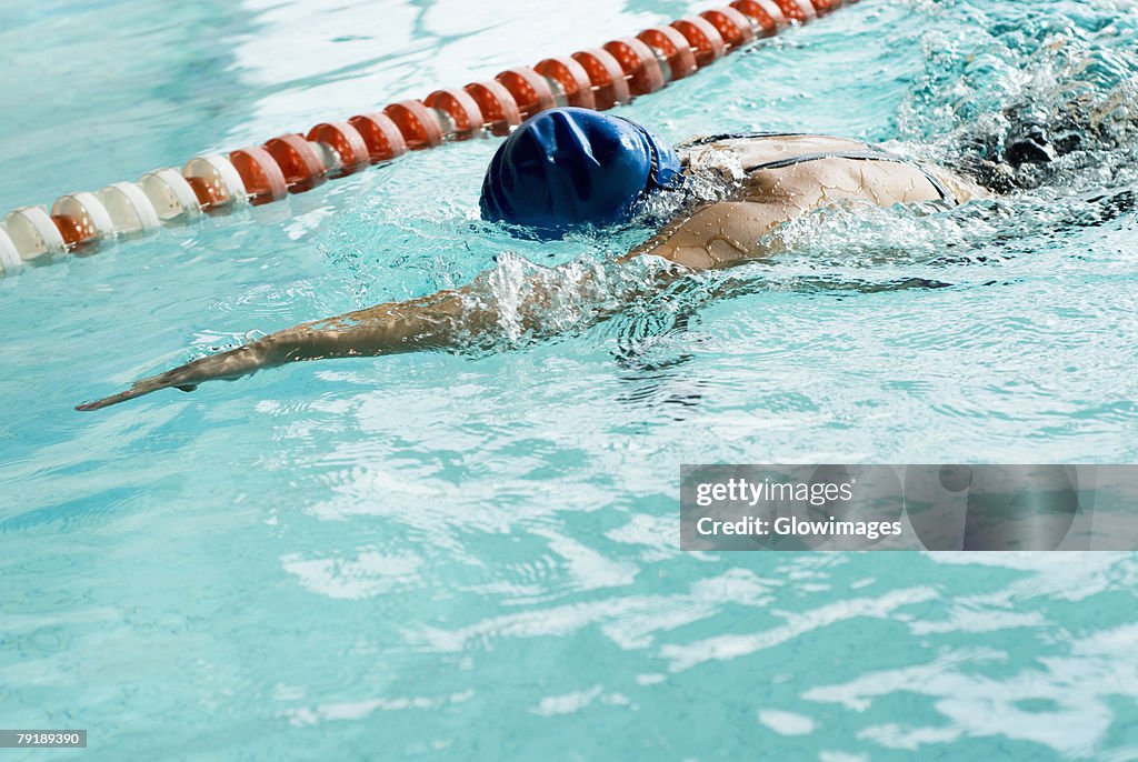 Close-up of a teenage girl swimming in a swimming pool