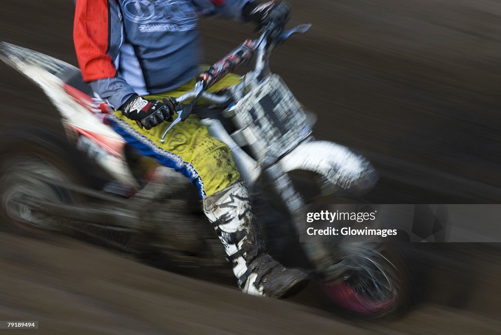 Low section view of a man on a racing bike