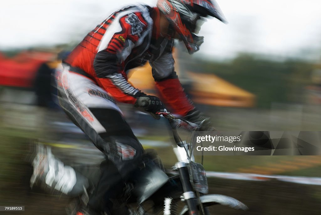 Side profile of a man on a racing bike