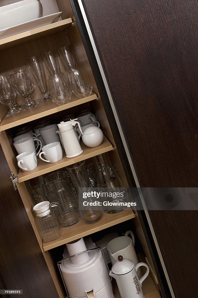 Potteries in a kitchen cabinet
